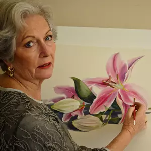 Carol Forbes Croad painting at her easel